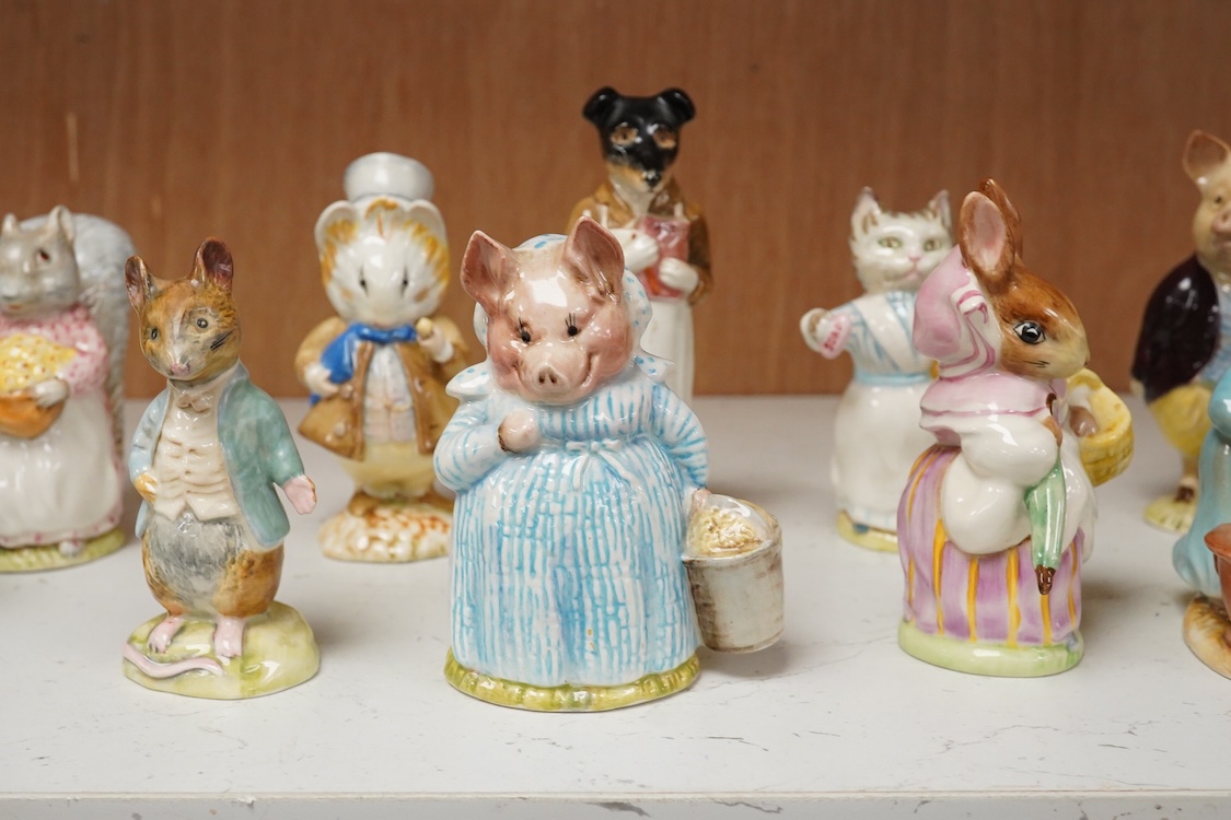 A collection of thirteen Beatrix Potter character figures, stamped with a gold stamp F Warne and Co Ltd, Beswick England, largest 12cm high